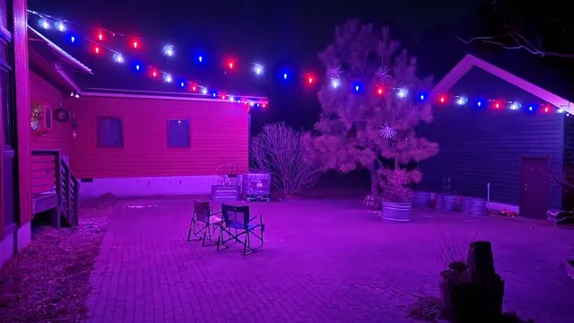 Backyard patio with vibrant magenta and blue color-changing lights