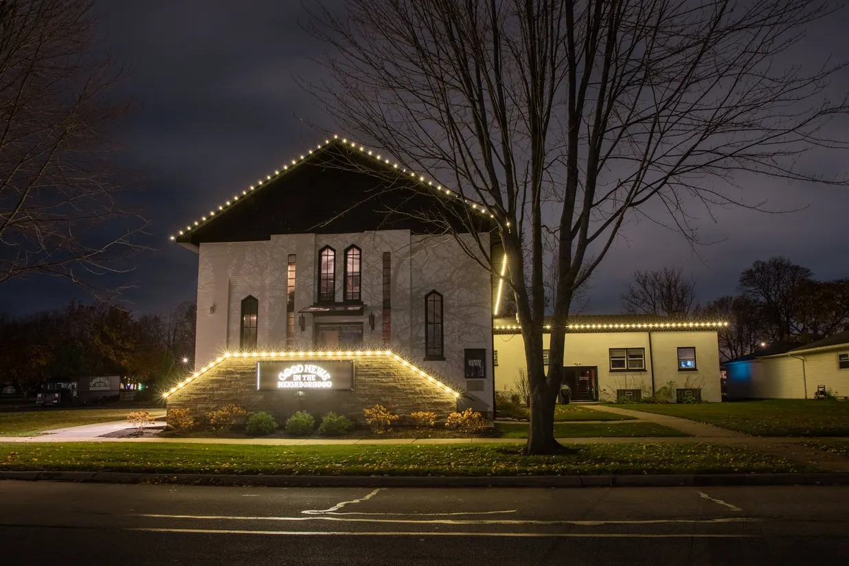 Beautifully lit house at night with holiday lights